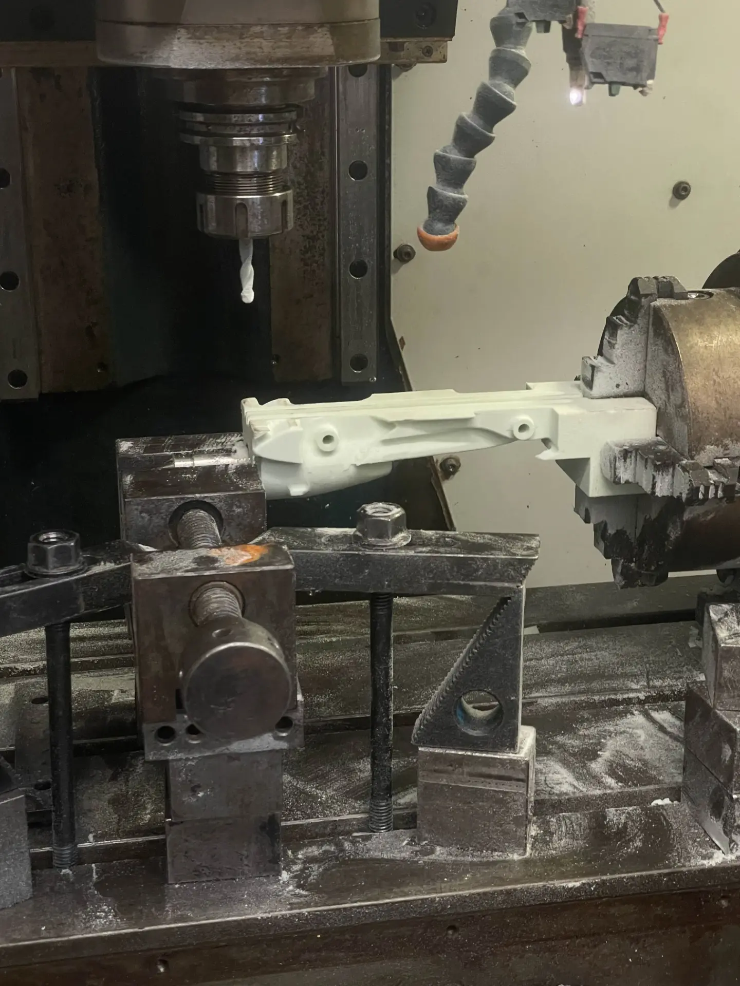 CNC machine machining a component during the PrecisionDigitalCNC internship